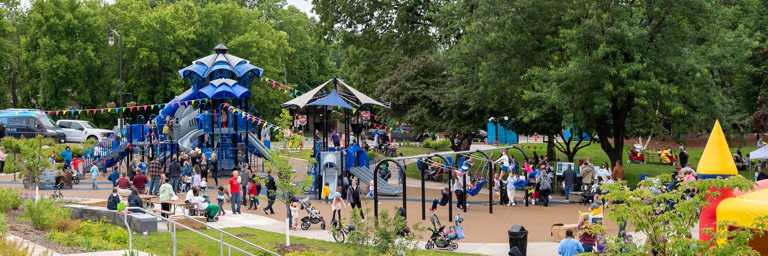 Community celebrating Walk & Roll in West Bridge Park, day of the ribbon-cutting.