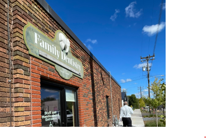 Monticello Family Dentistry with faded, old signage.