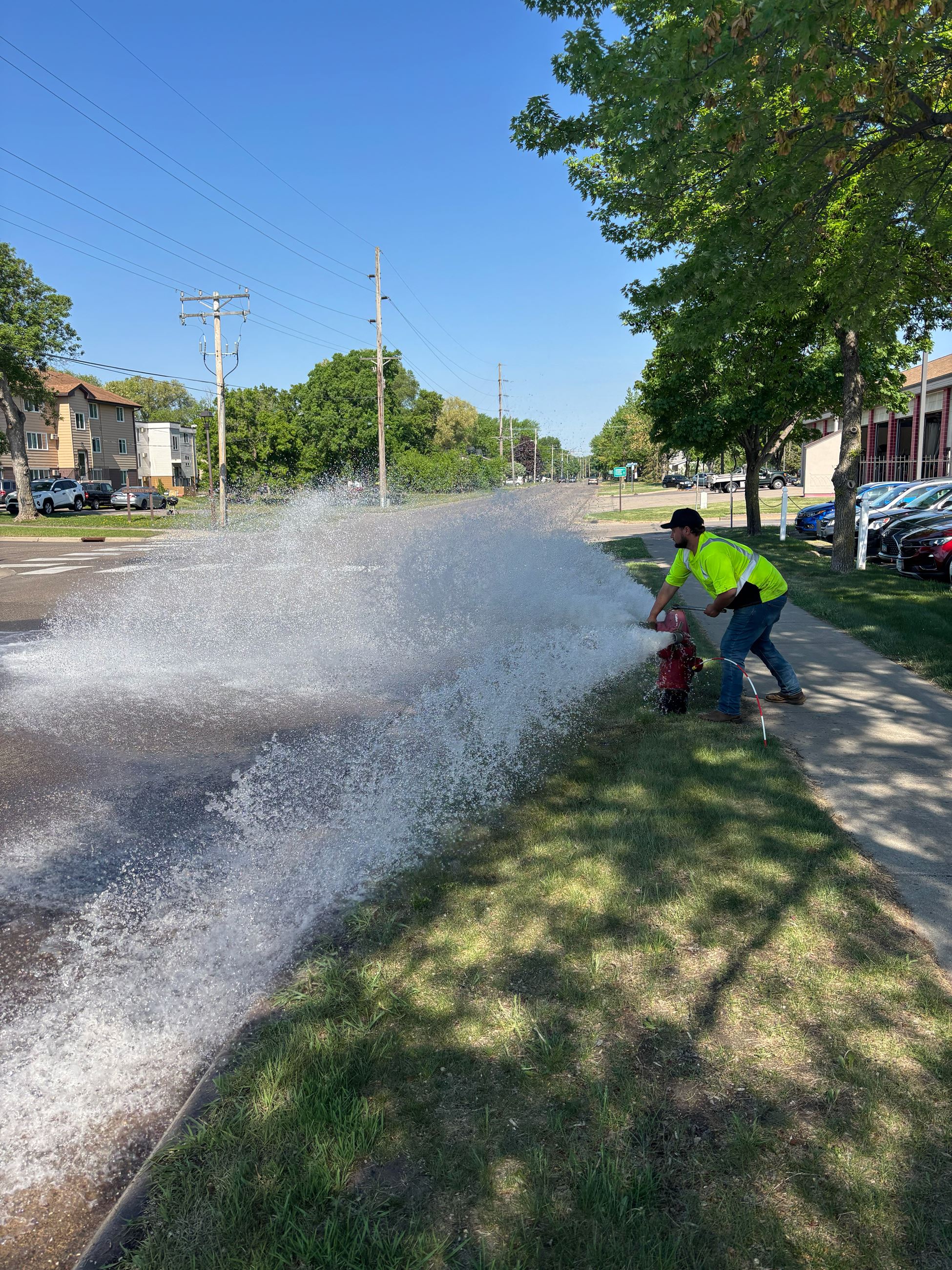 A Public Works employee flushing a hydrant